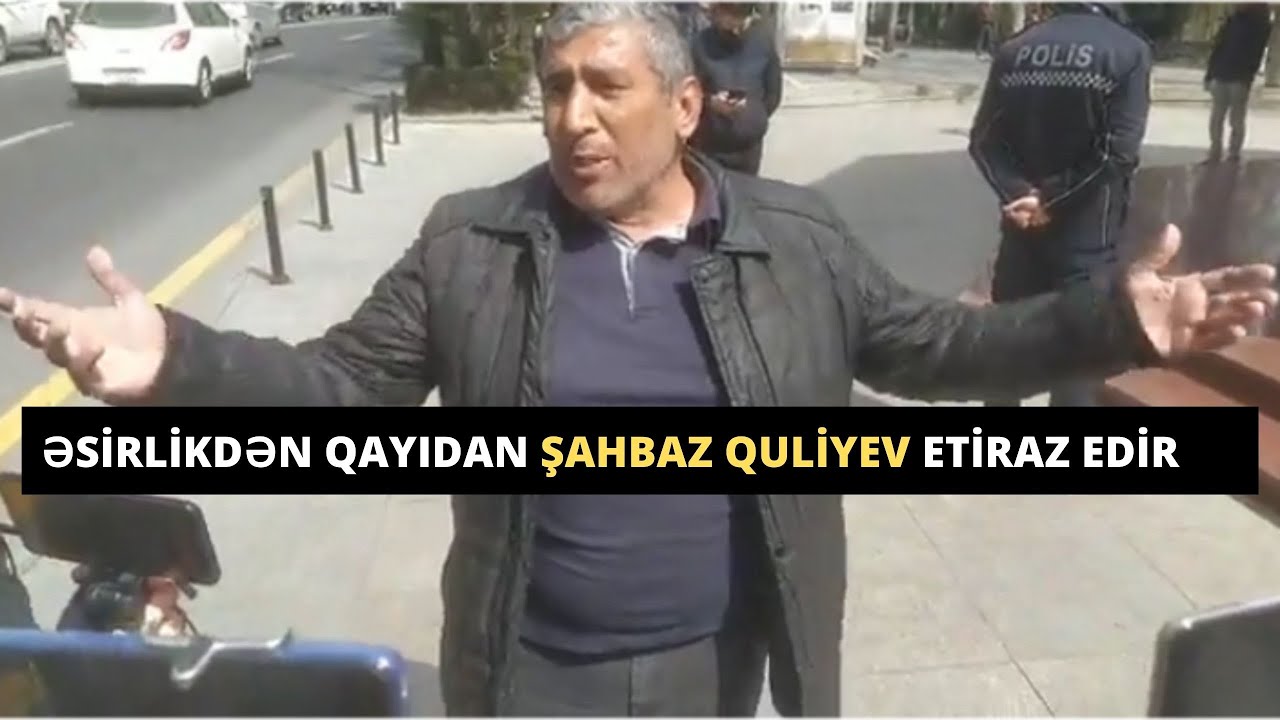 Əsirlikdən qayıdan Şahbaz Quliyev etiraz edir və qolunu polislər burub etiraz edərkən.