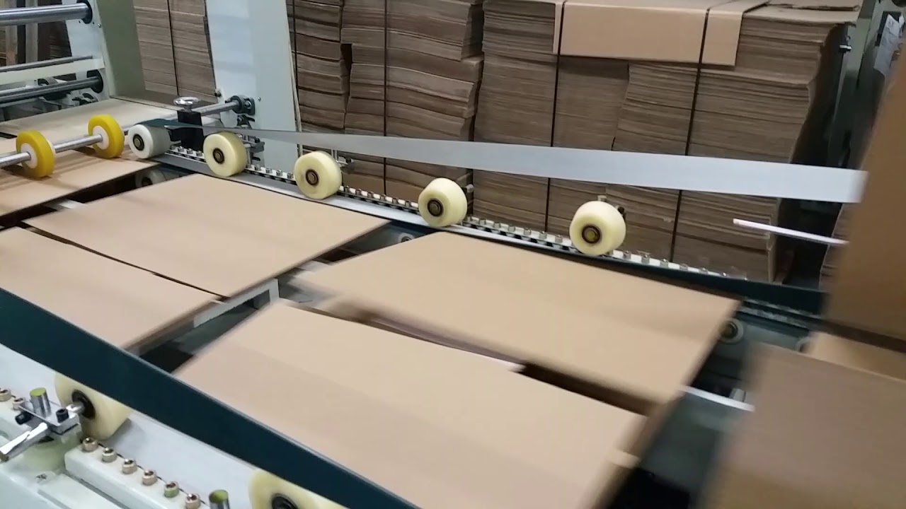 KEMN PACK -Fabrica din Focsani, Vrancea. Lipirea automata a cutiilor din carton ondulat.