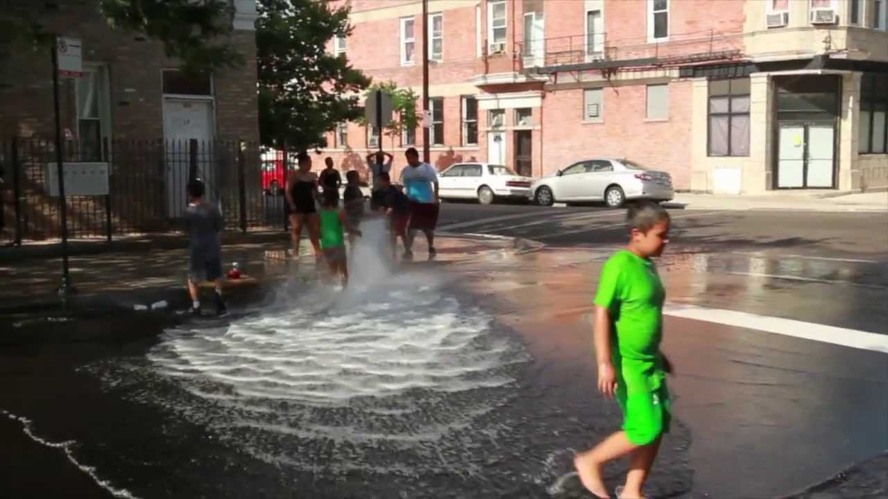 Kids cooling in open hydrant