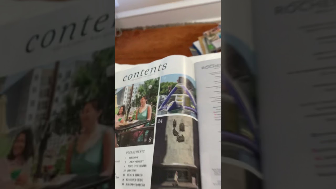 Me looking through the Experience Rochester magazine