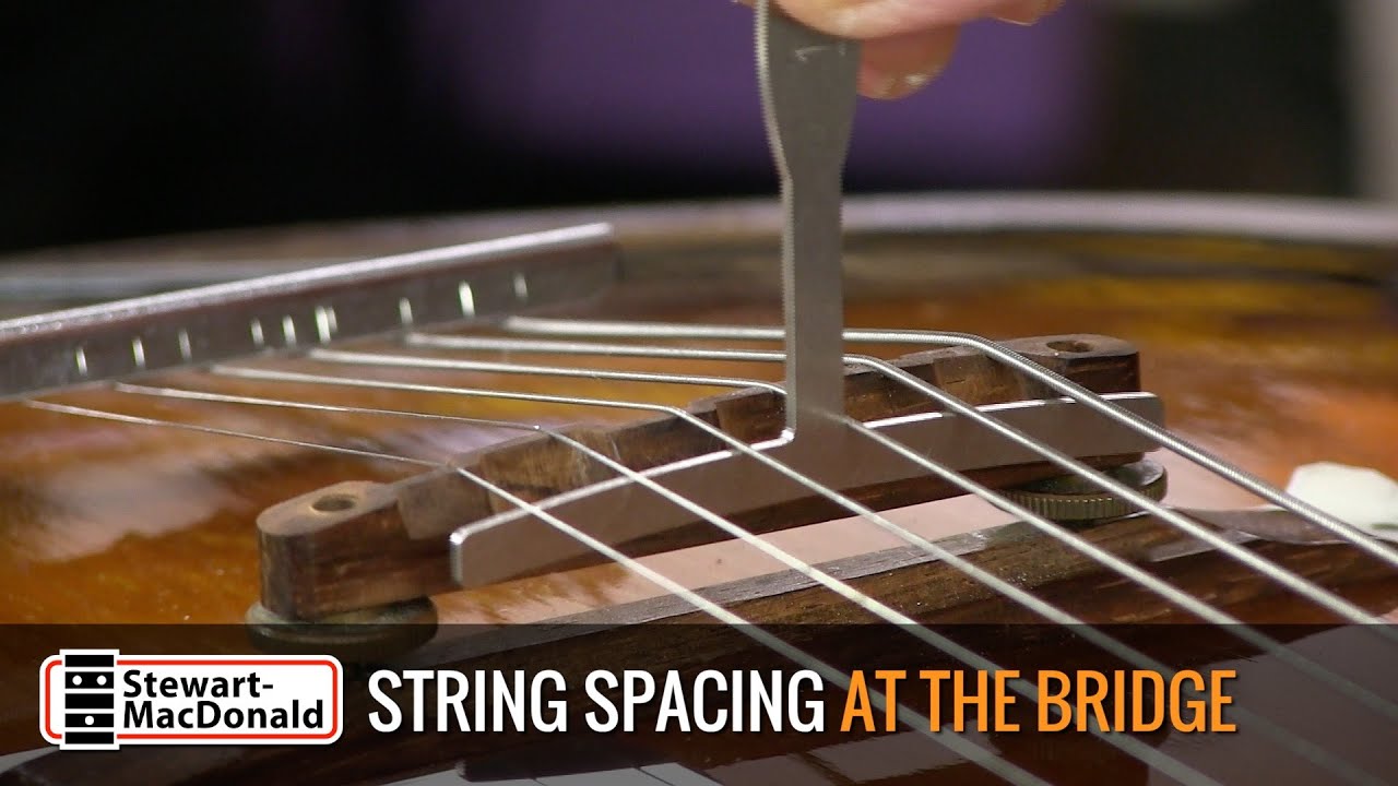 Setting guitar string spacing at the bridge