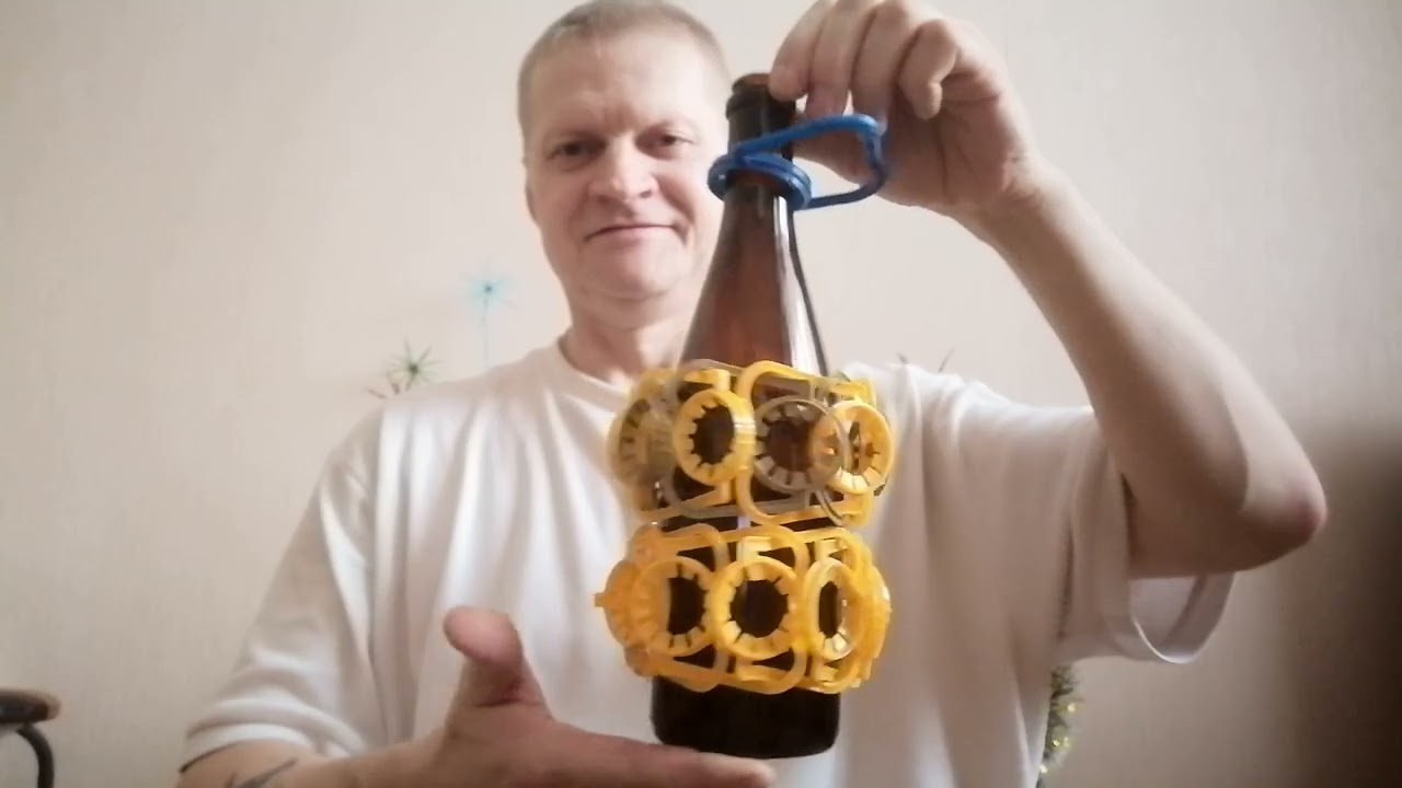 Оплёл бутылку, держателями из под кваса 