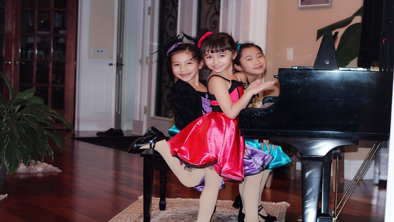 RMA Students Wenlee Vazquez (6), Zimo Wen (7)and Julia Mu (8) perform Out...Standing! by Kevin Olson