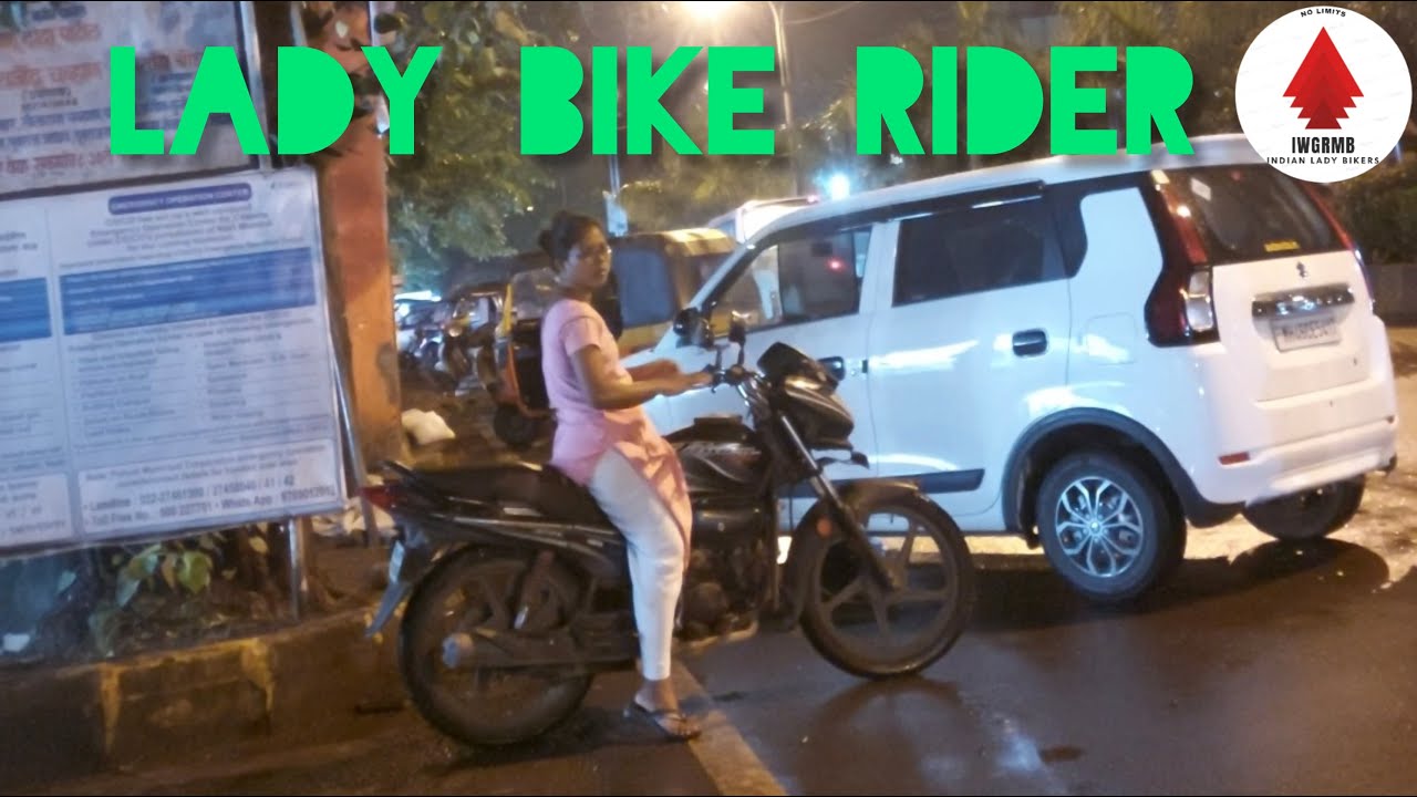 A Lady Riding Bike in Busy Market