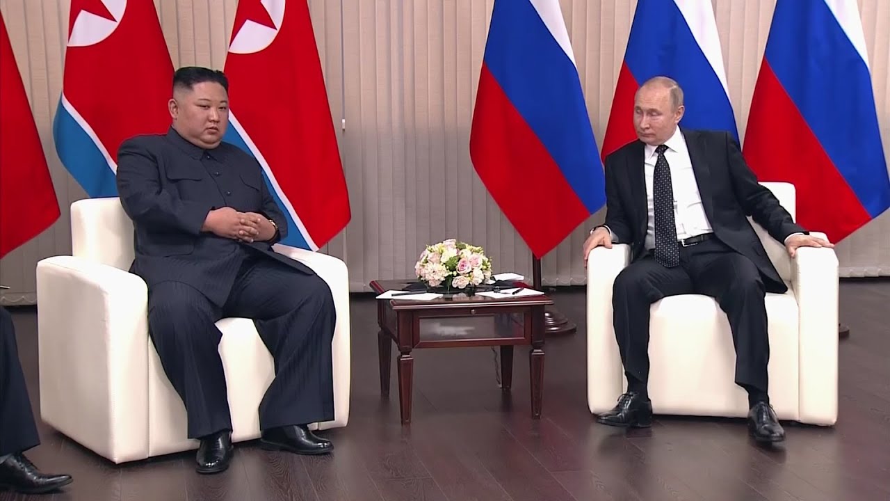 Putin and Kim shake hands at start of talks