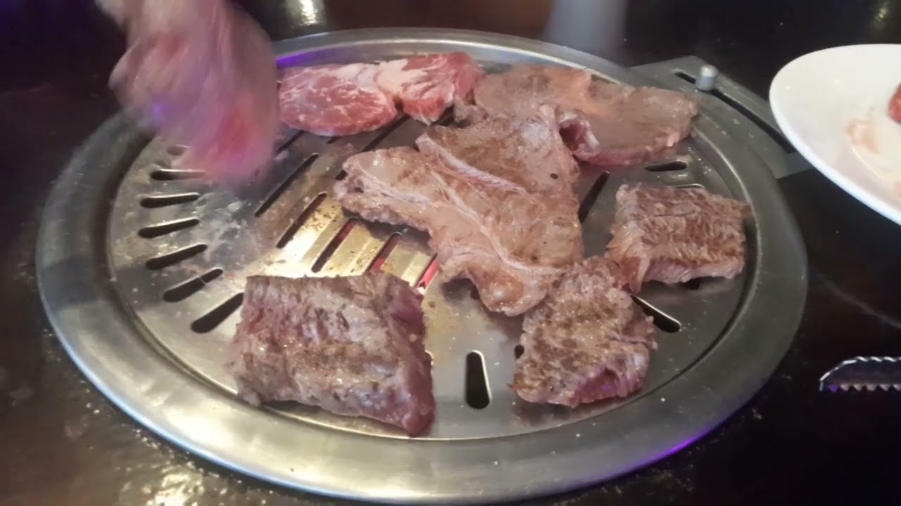 Cooking meat in Korean BBQ, BBQ city bankstown.