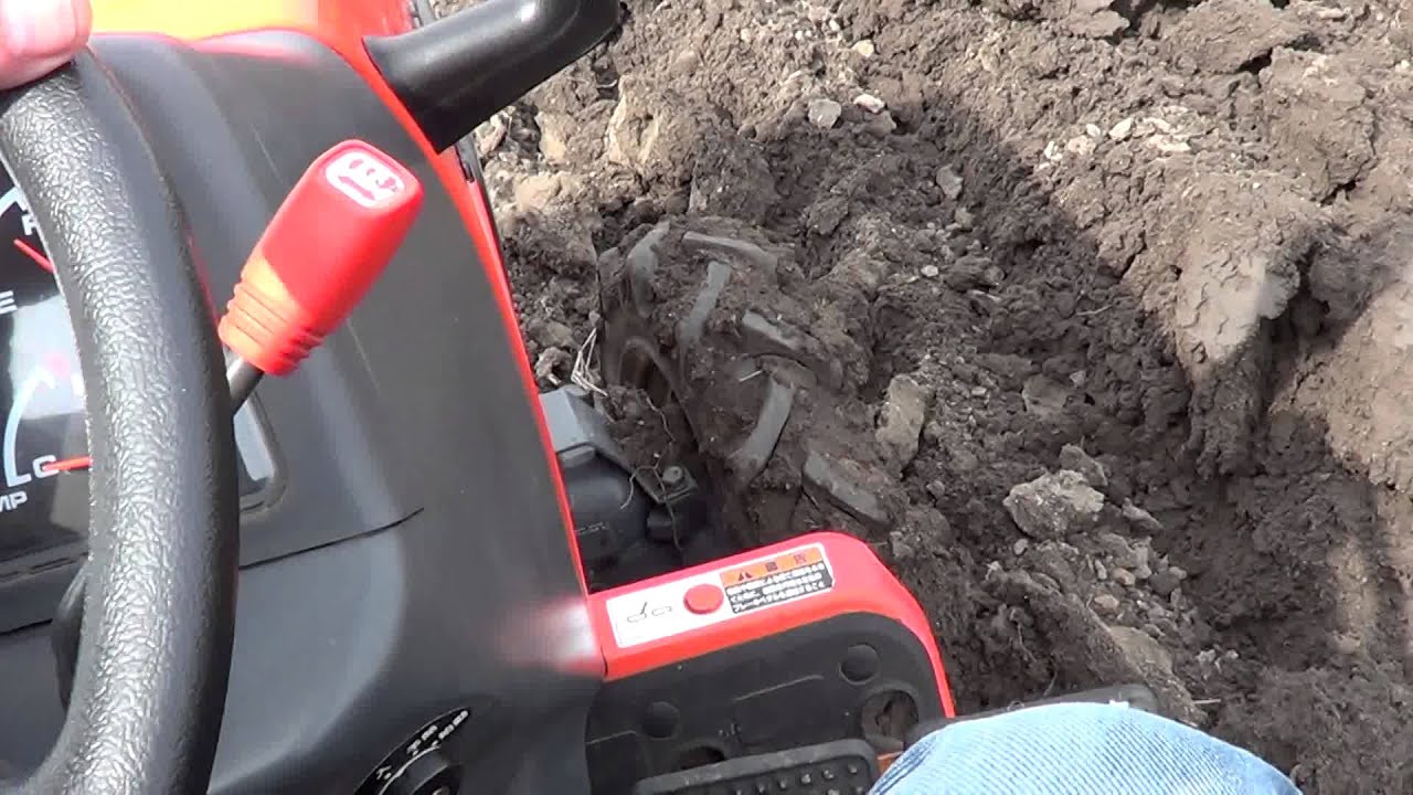 Kubota tractor GB 13 ploughing