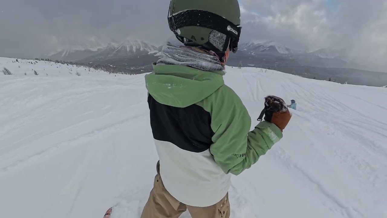 Pseudo impaired sister and brother from the equator descend left side of Lake Louise West Bowl