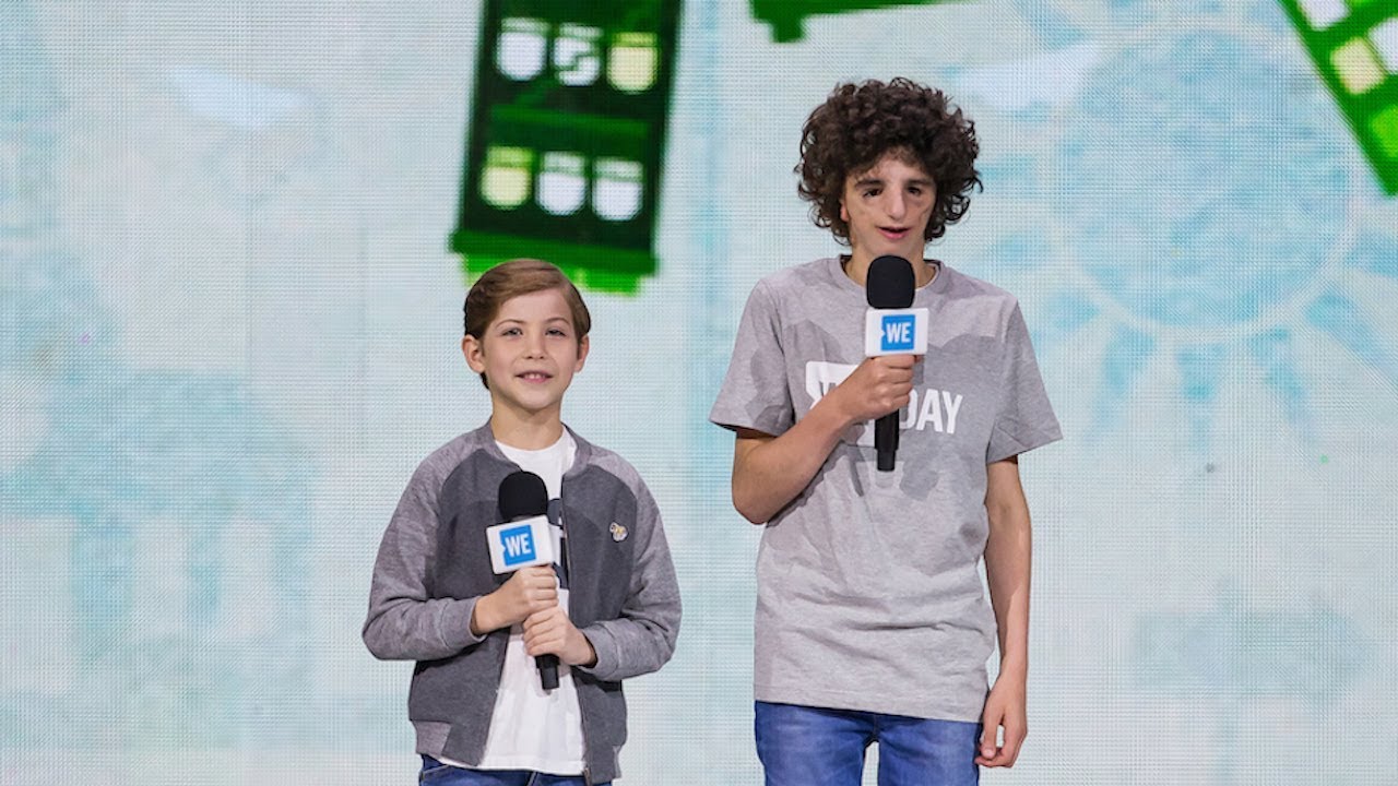 Jacob Tremblay and Nathaniel Newman speak together onstage at WE Day Seattle