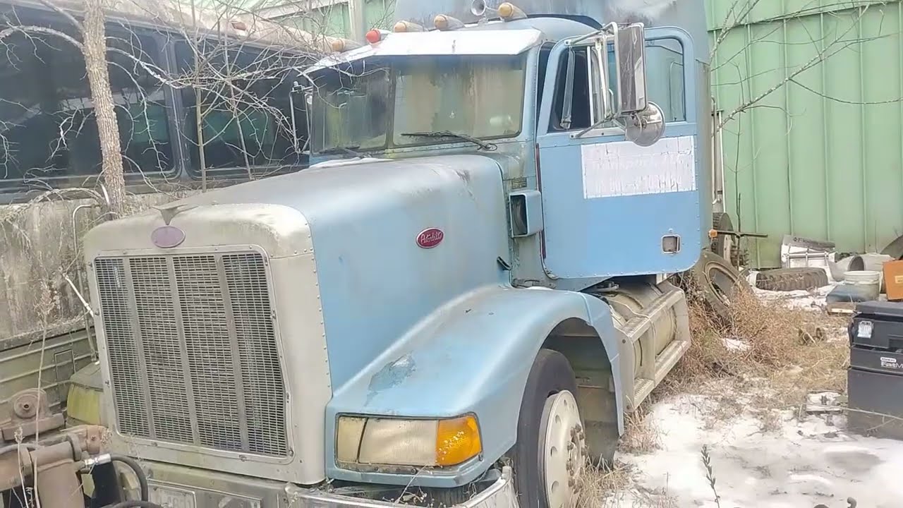 Abandoned Peterbilt Rusting in Junkyard
