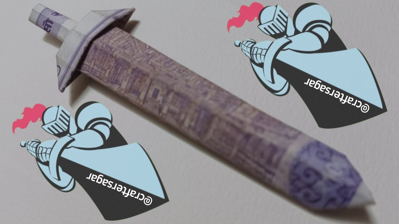 money origami sword with 100 Rupees note