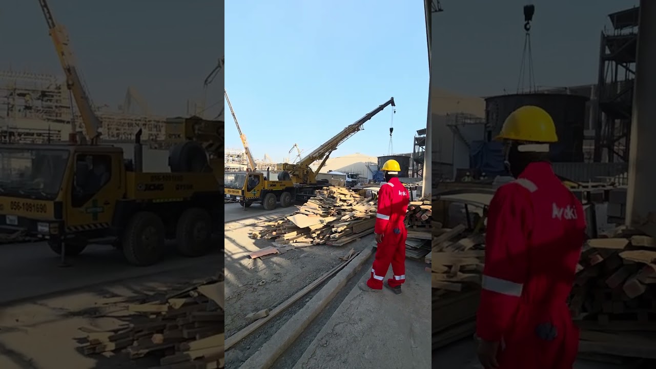 Crane lifting large plate metal