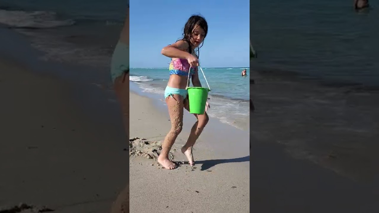 Kids are playing on the beach with sand. making sand castle