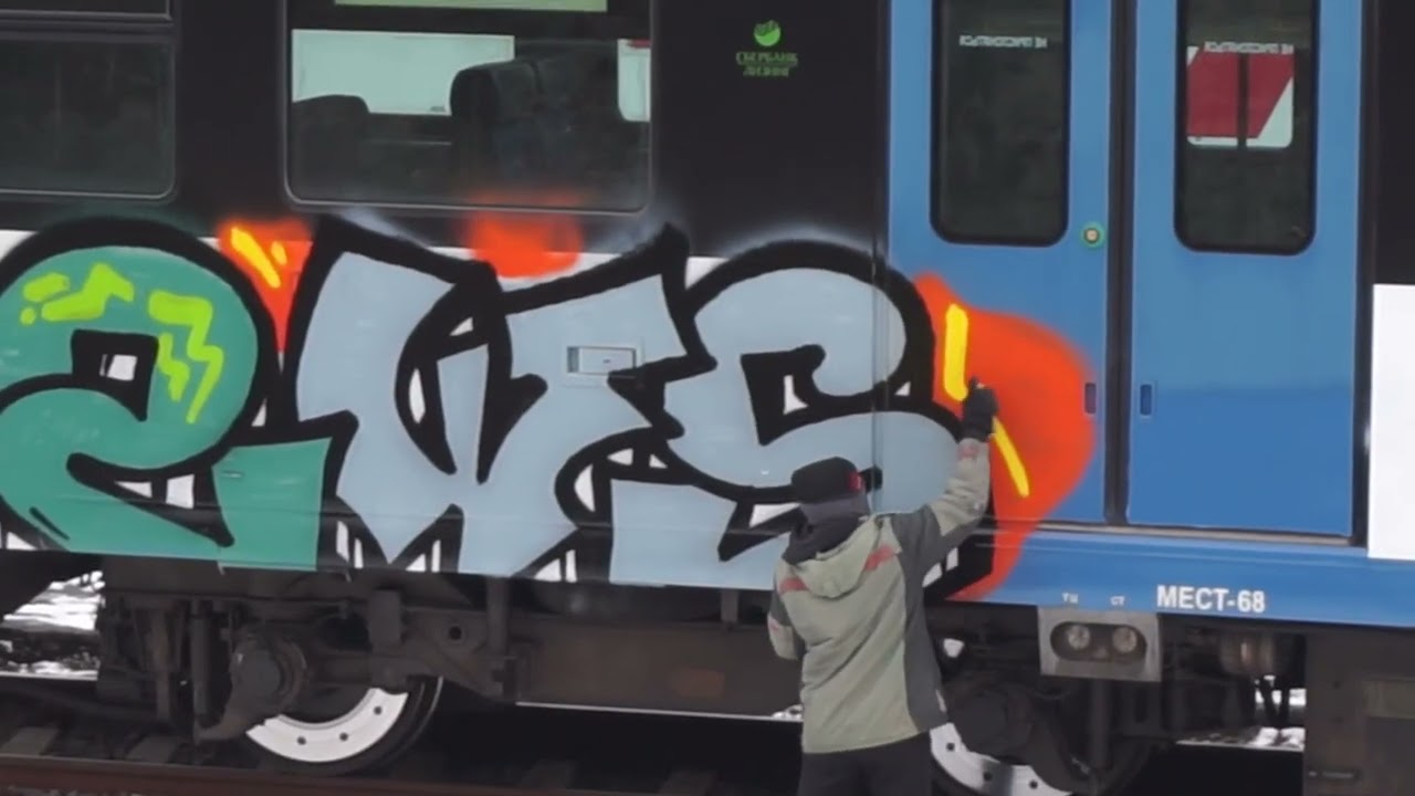 Graffiti on white trains.