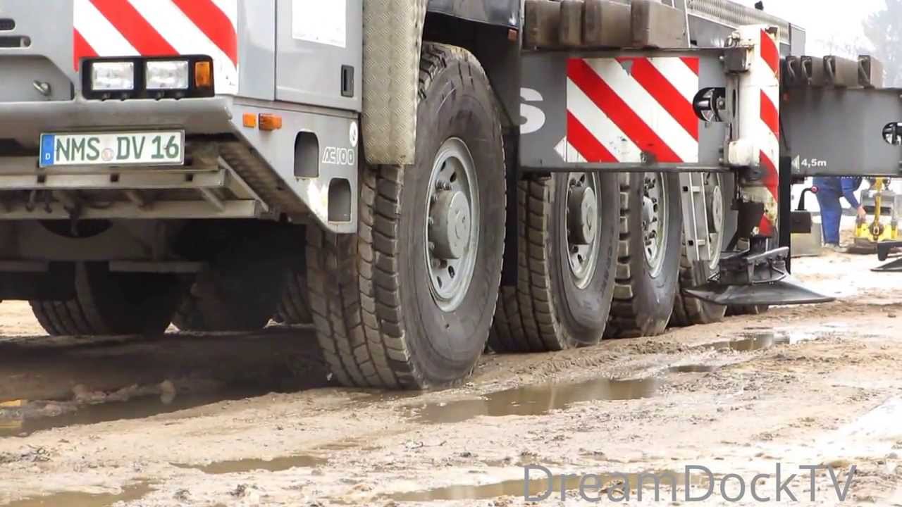 TEREX DEMAG AC100 MOBILKRAN AUTOKRAN HEBT BETONTEILE AUF BAUSTELLE