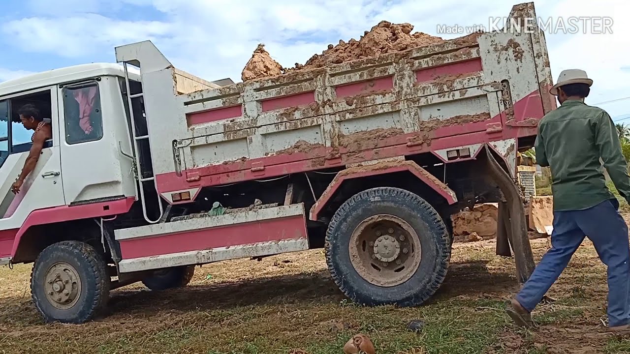 Dump truck dumping dirt | Bulldozer pushes the dirt