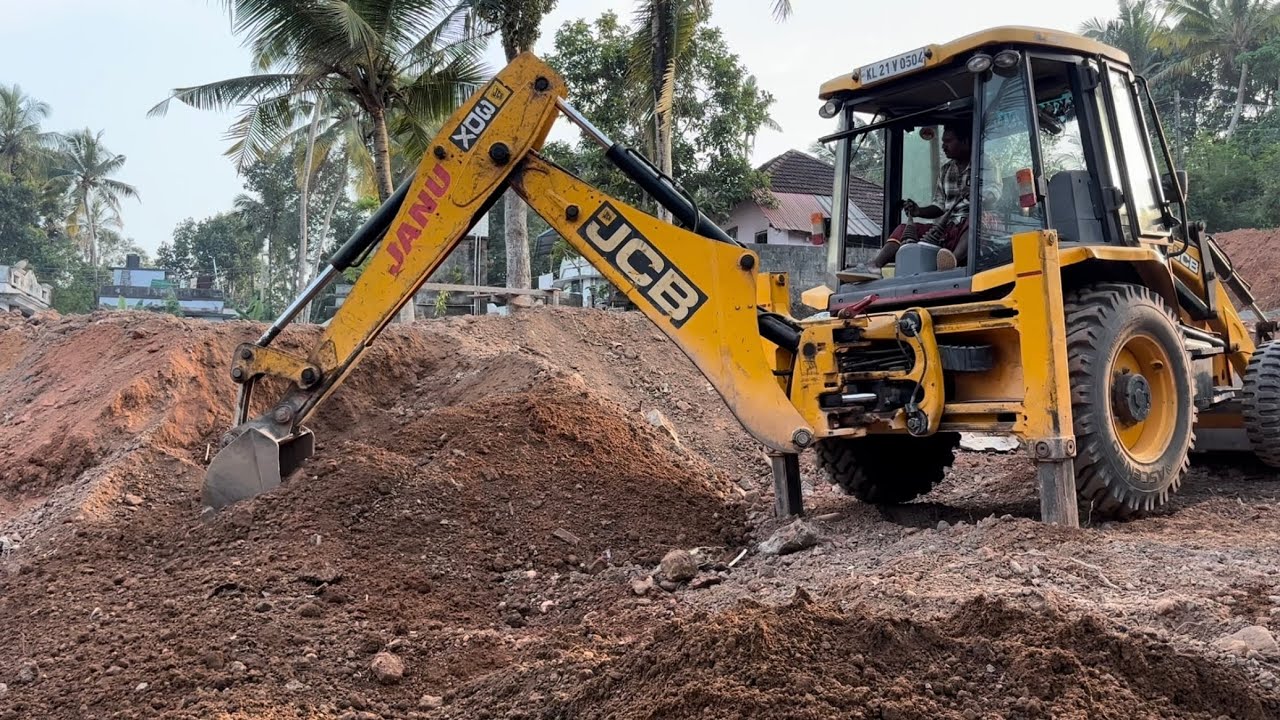 Jcb 3dx collecting and moving soil downwards 