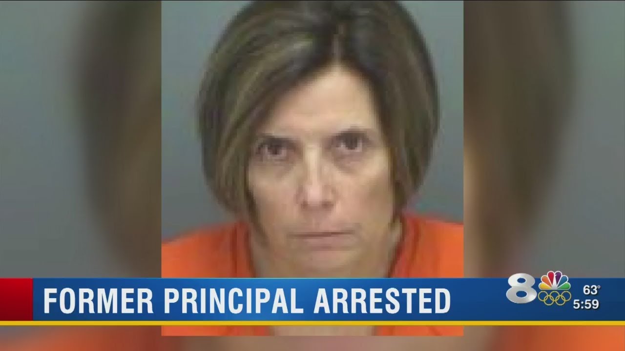 Former principal arrested