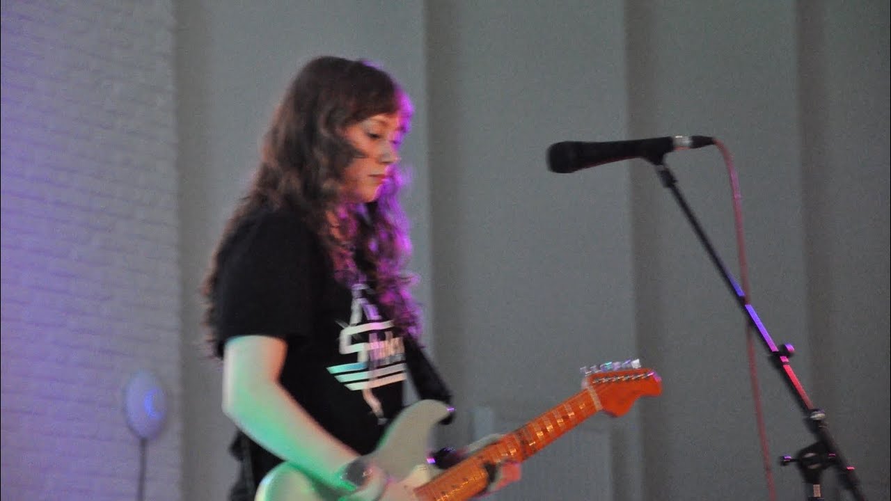 Playing my song in front of my school