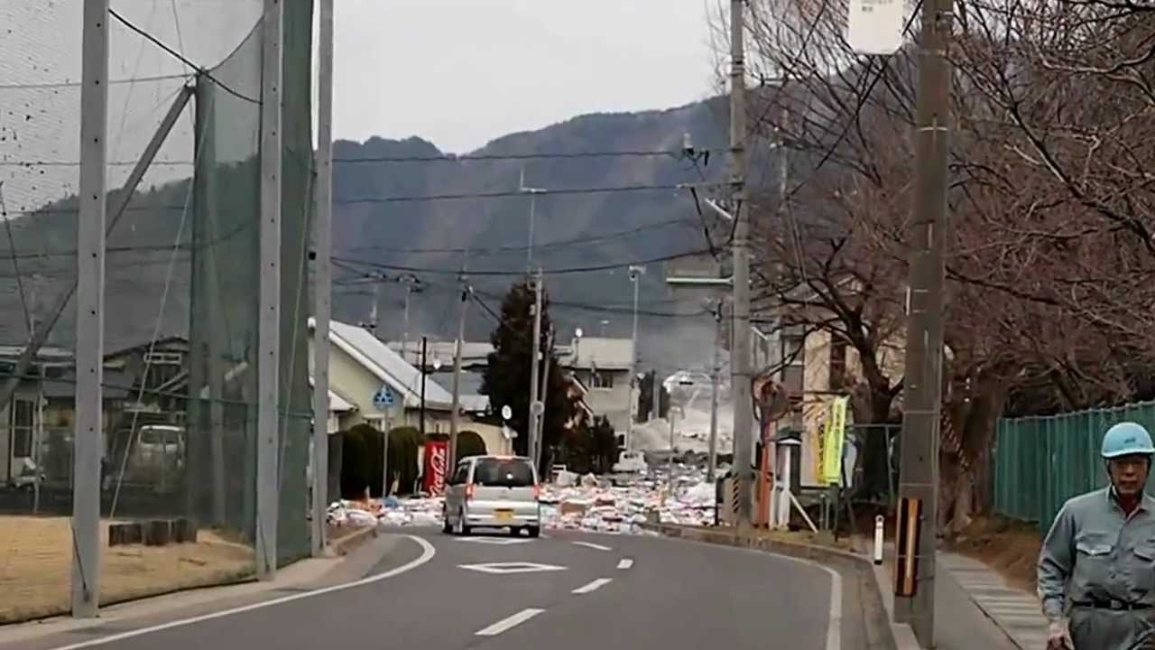 2011 Japan Tsunami: the water pouring over the seawall in Miyako [Stabilized]