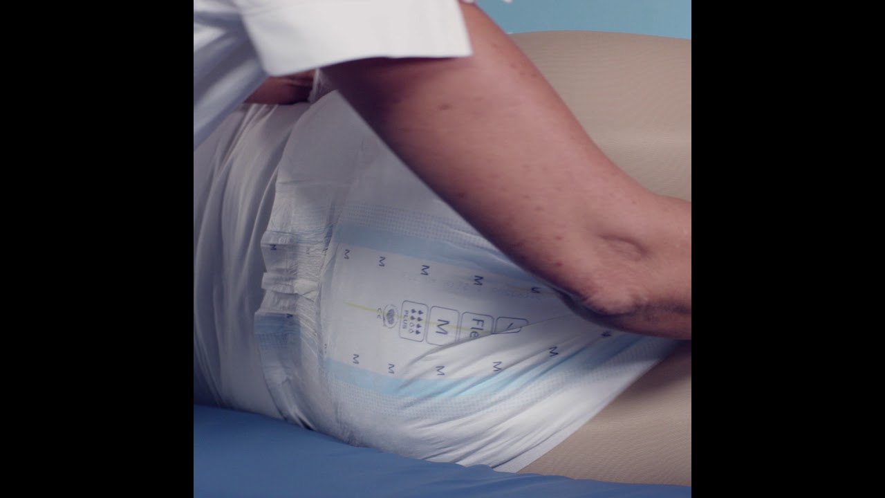 Instructions for how to apply a TENA Flex on a user from the front 1 1