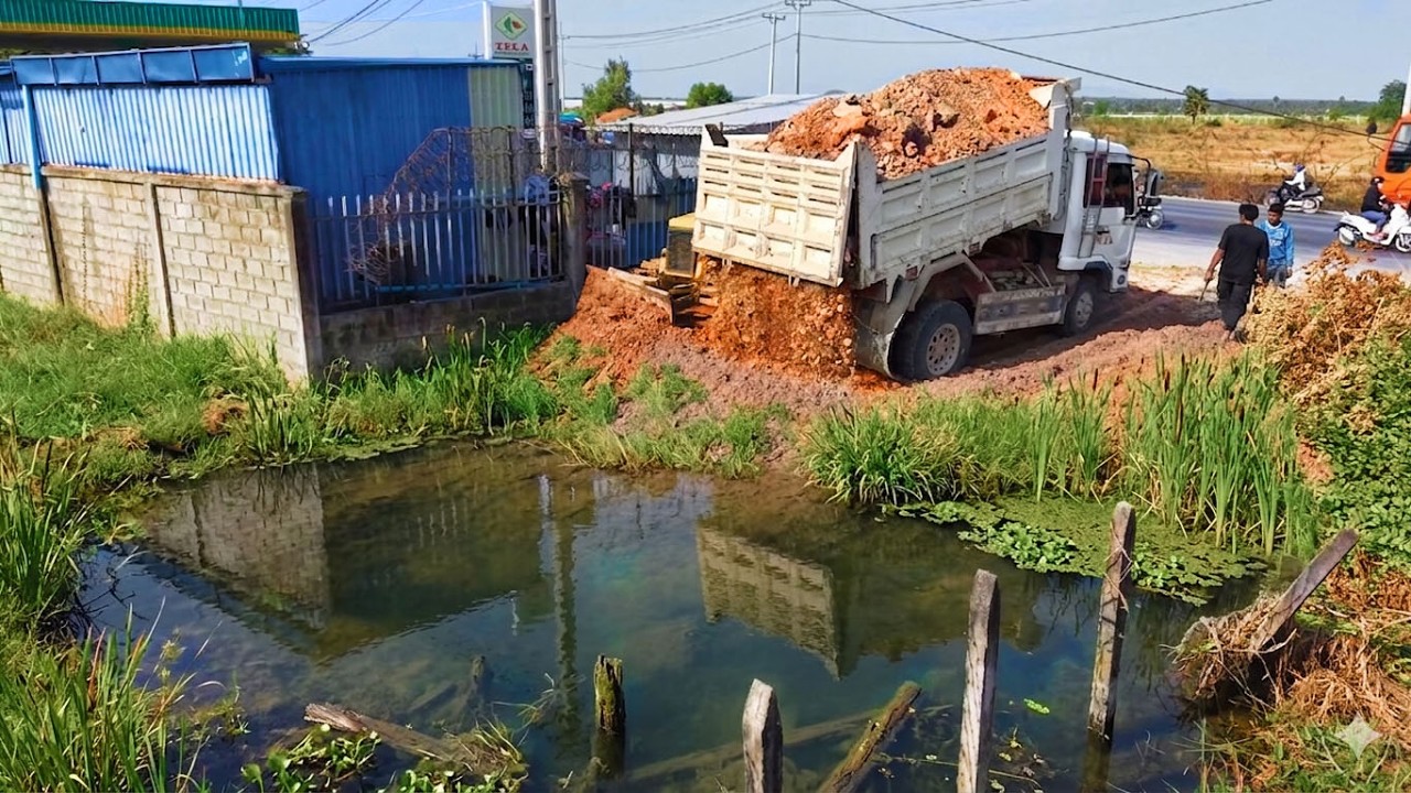 Starting Landfill New Project!Dump Trucks Filling land Flooded Area,Skillful,dozer D21 Pushing Soil