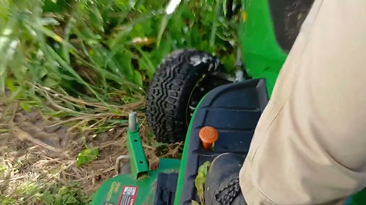 Mowing and pushing with John Deere X739 Garden Tractor 
