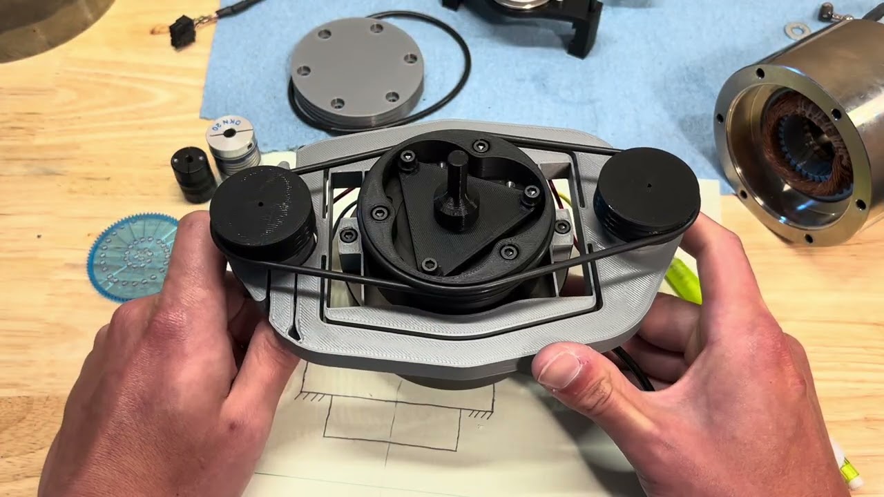 Flexure decoupled belt drive for ultra-precision spindles