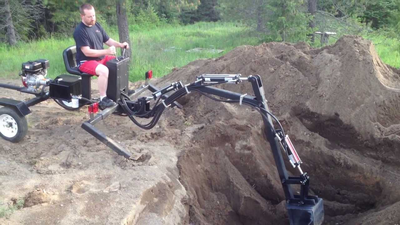 Digging the Pond with the towable backhoe