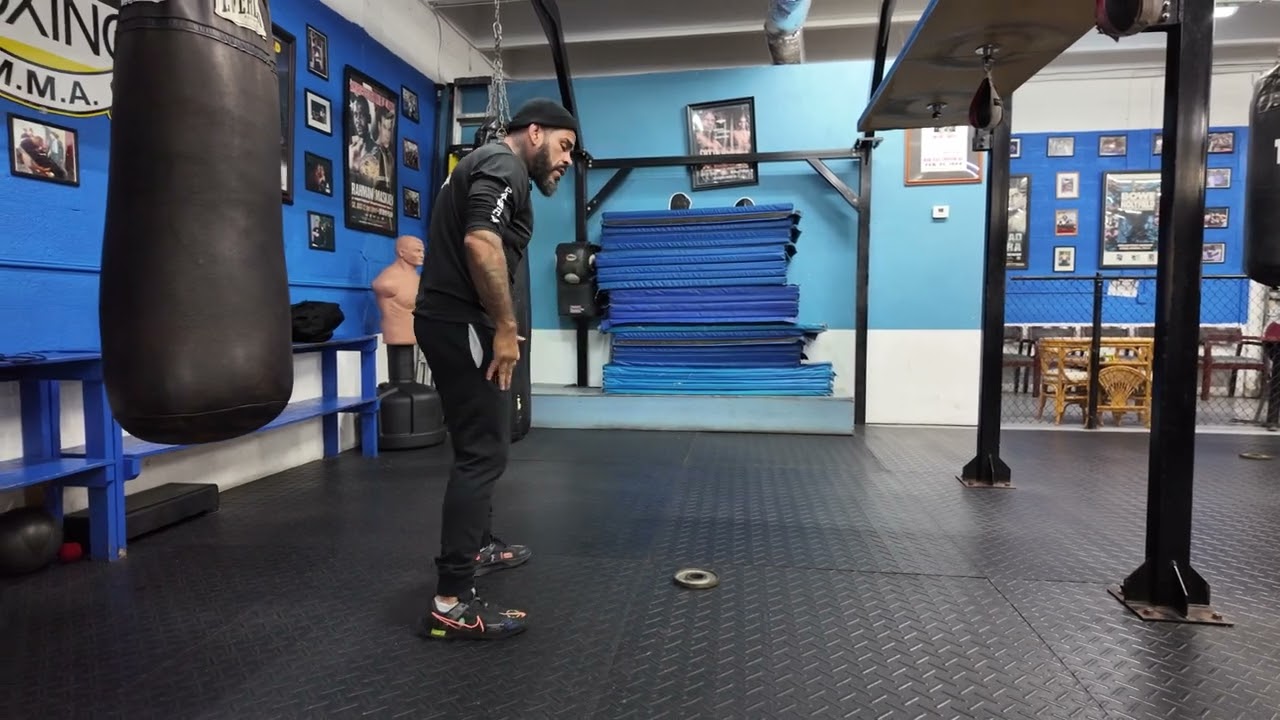 Coach Cisco works on foot position & hip movement during Boxing Fundamentals at Palm Beach Boxing.