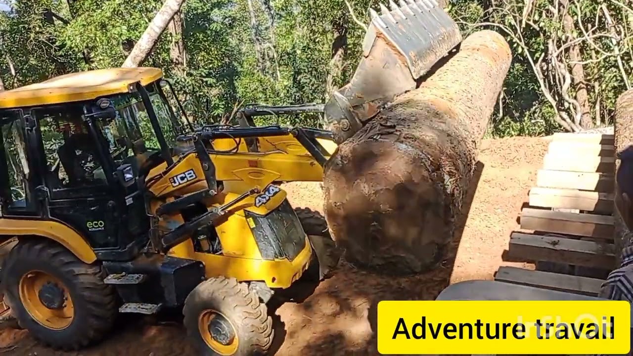 10 tyre truck in quarry. loading timber using jcb