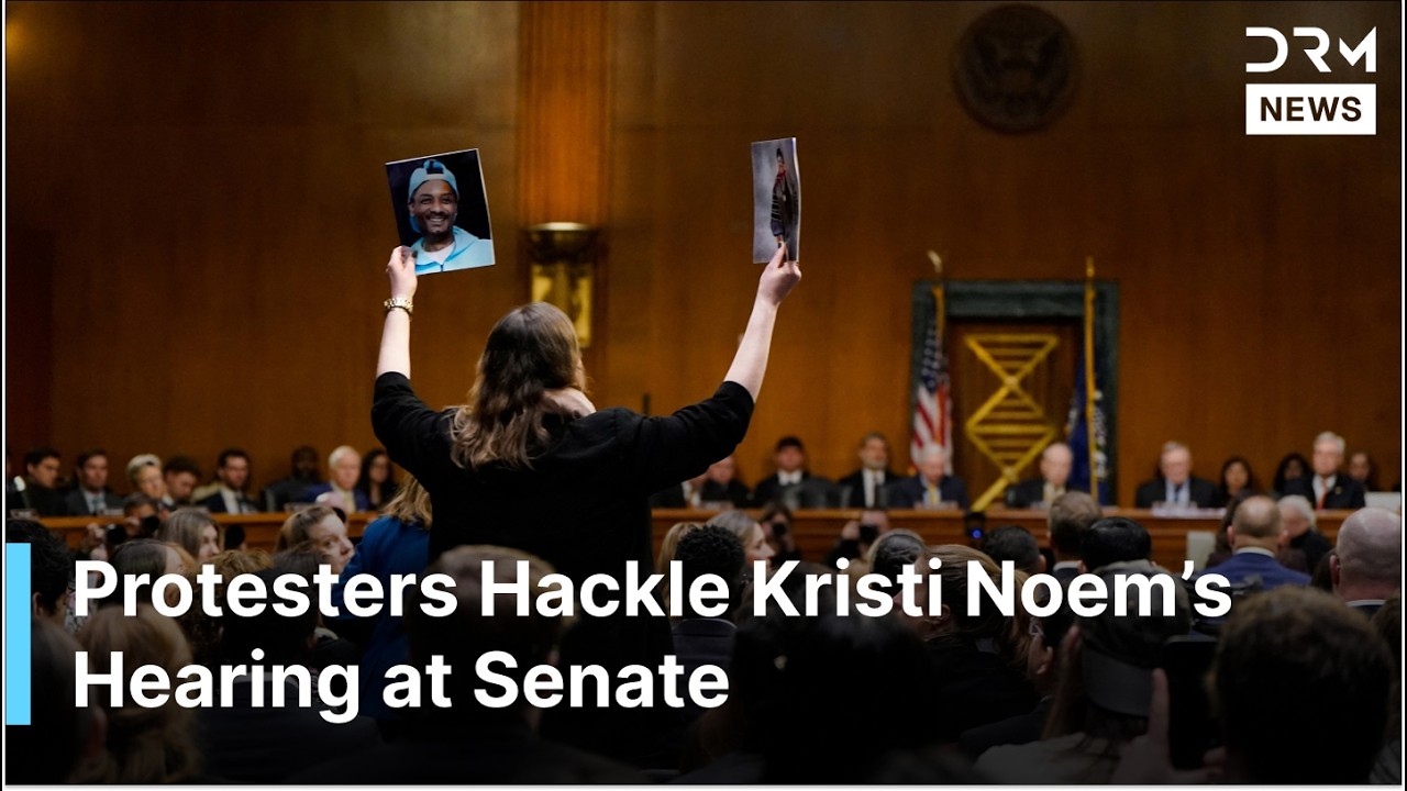 SENATE HEARING INTERRUPTED as Protesters Hackle Noem, Hold Pictures of Renee Good, Alex Pretti| AC1G