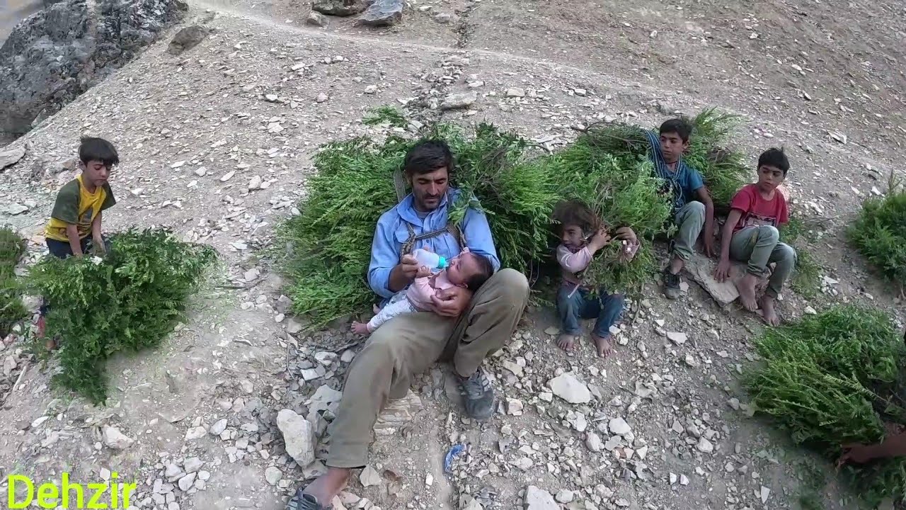 Making a cradle for a baby by the father of a nomadic family
