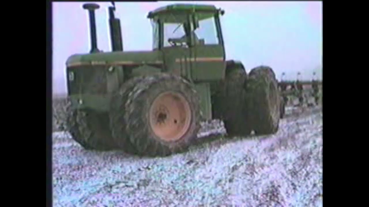John Deeres plowing in January 1980, s