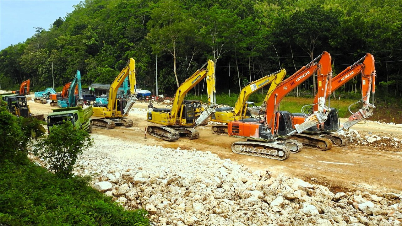 Hitachi Komatsu Kobelco Excavator March Crawling Together to The Road Construction Site