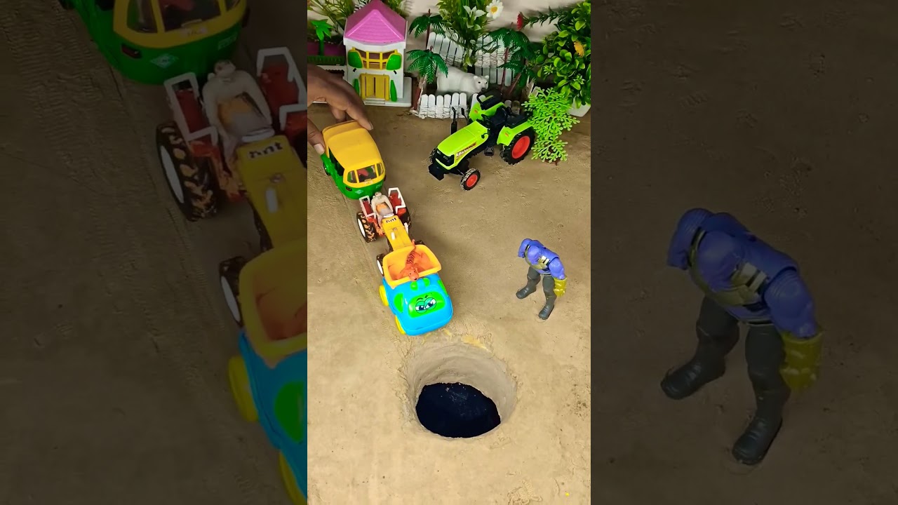 Pushing tractor and car in pit 