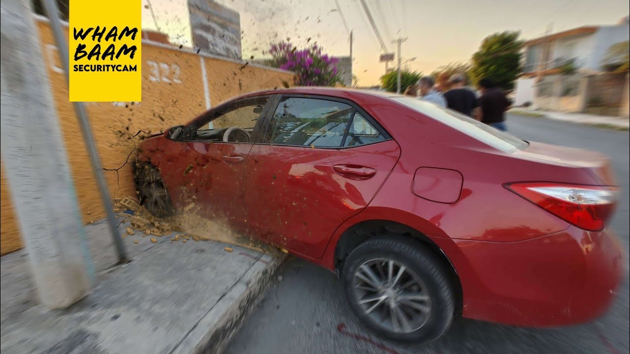 CCTV CAUGHT CAR CRASHING THROUGH A WALL