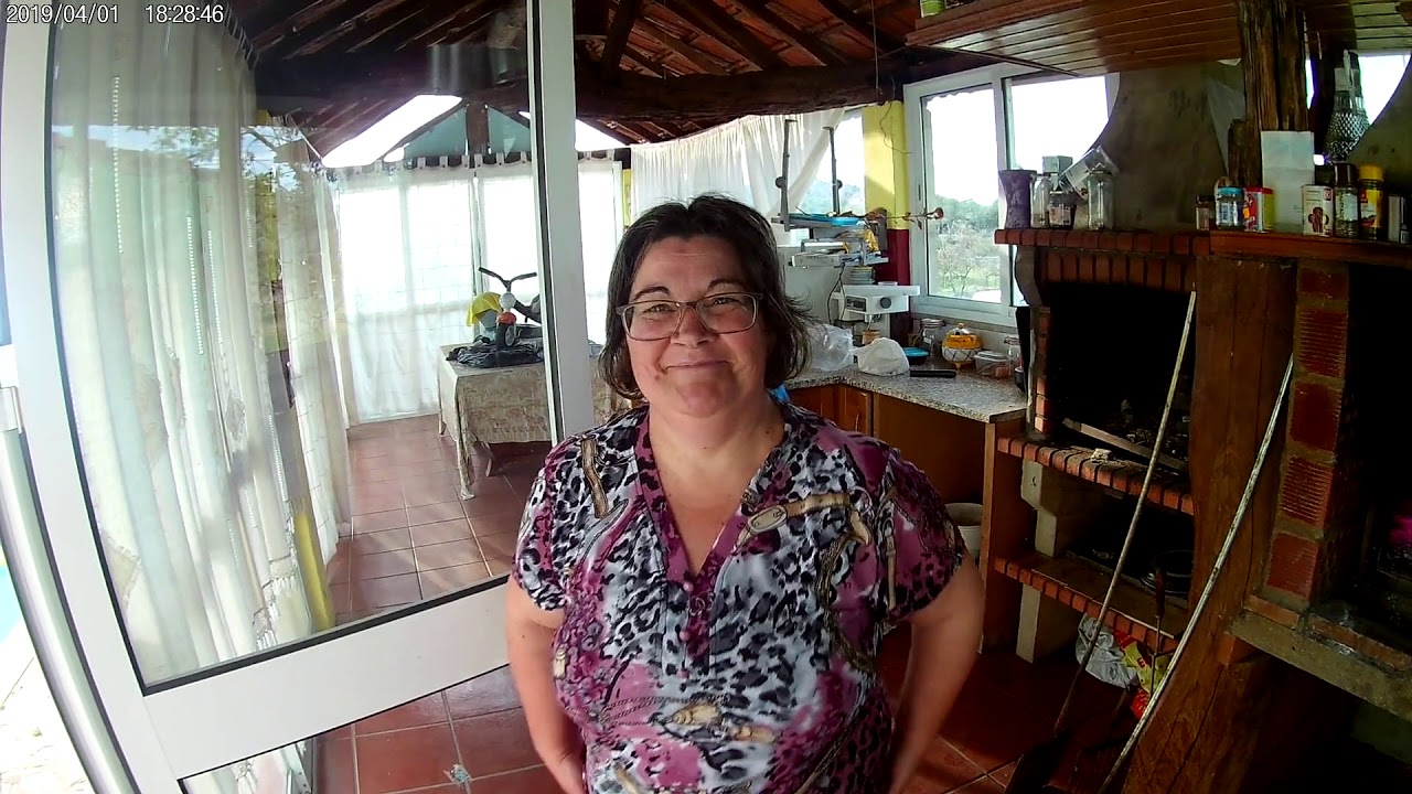 Portuguese woman baking traditional bread.