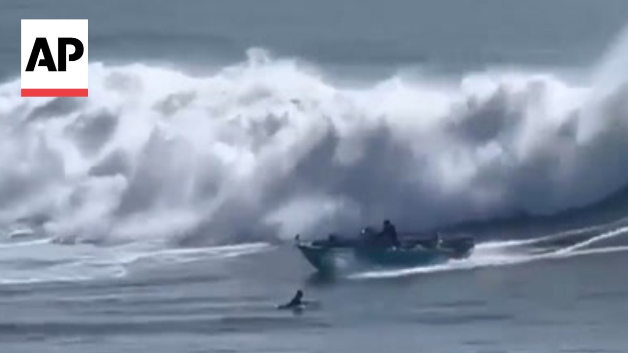 Video shows ocean waves capsizing a boat in Santa Cruz, California