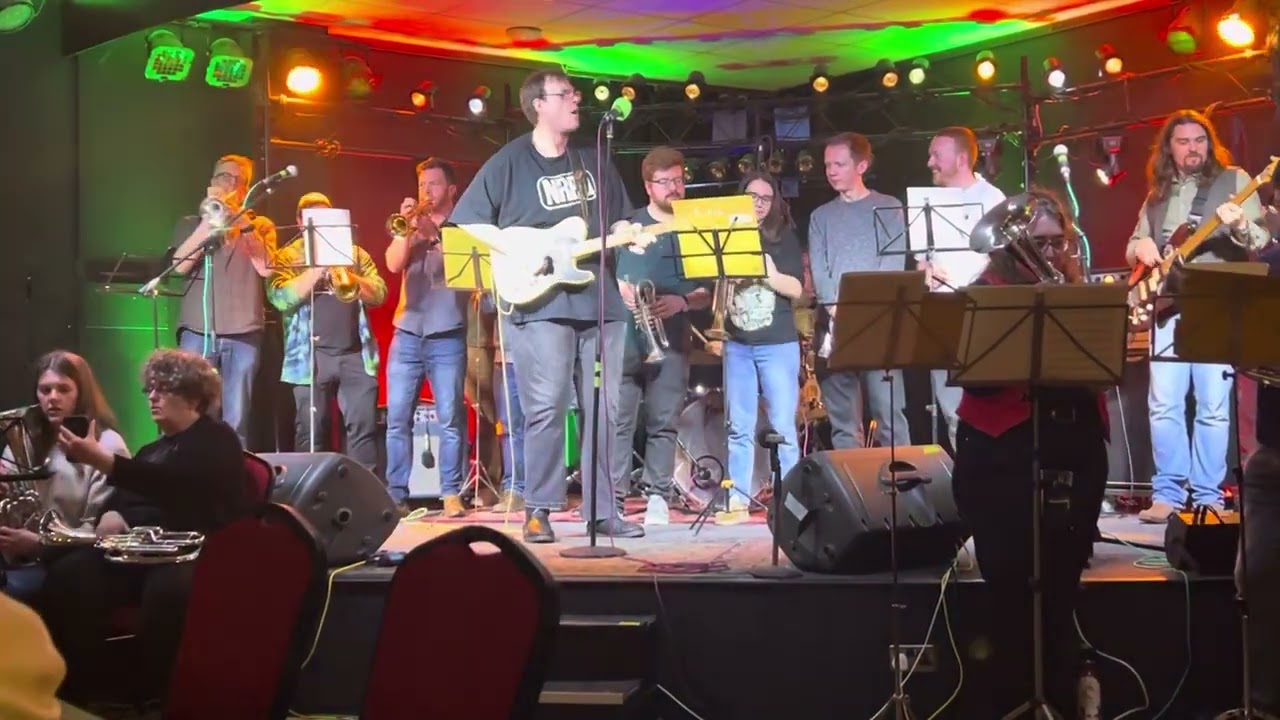 James Oliver with the cathays brass band rock n roll guitar