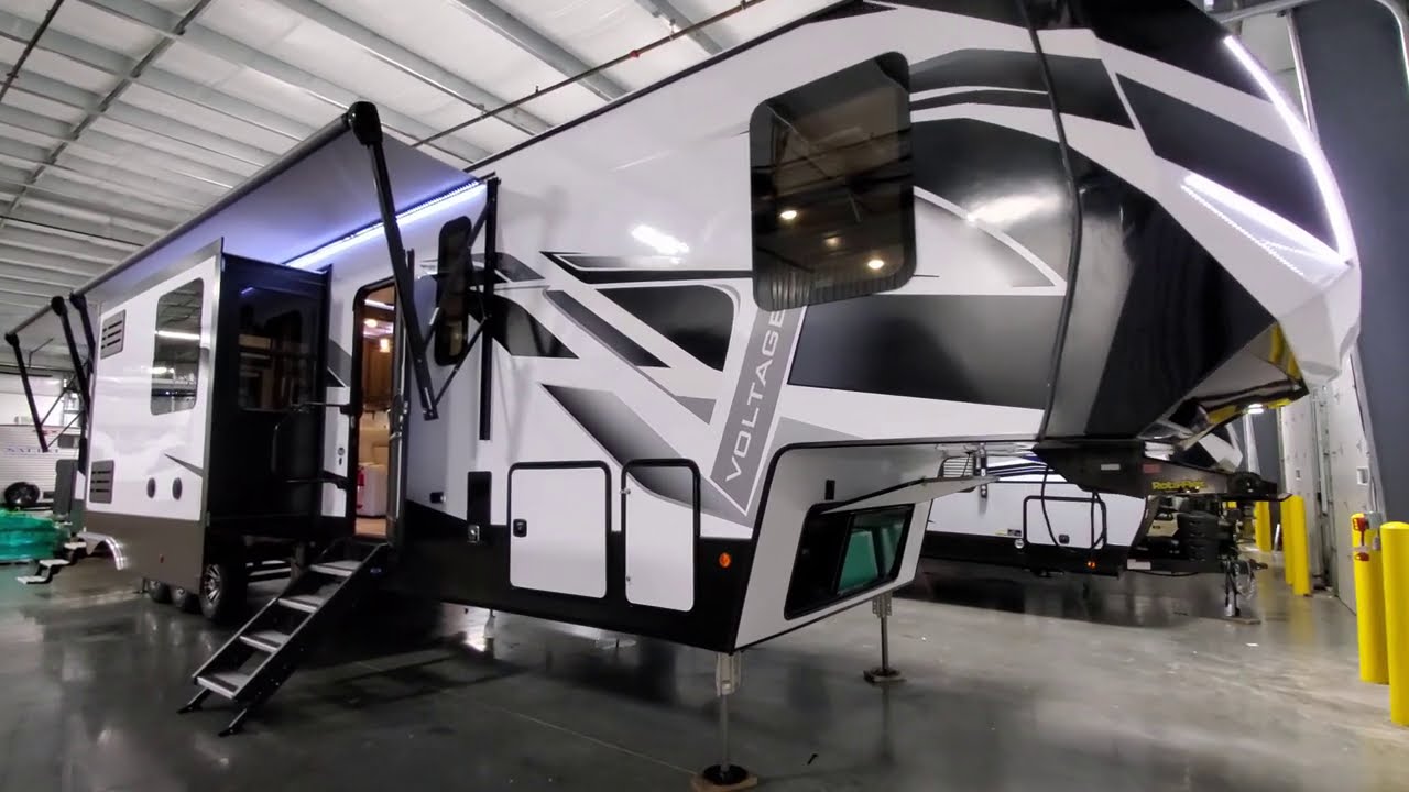 Model Change 2021 Voltage 4225 Toy Hauler Fifth Wheel Couchs RV Nation a RV Wholesaler Walk through