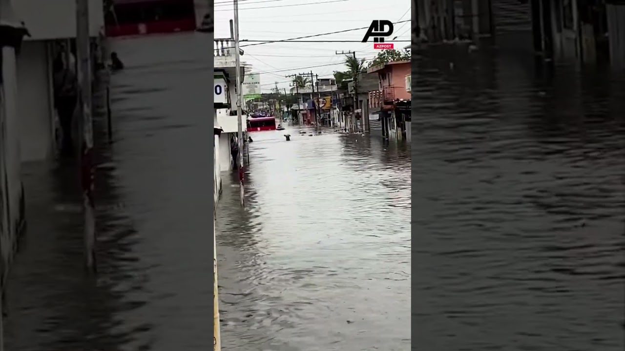 Locals dive into flooded streets in eastern Mexico #mexico #flood #flashflood #floods