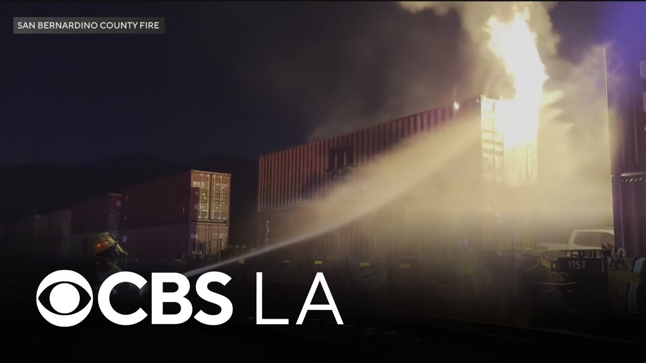 Rail car carrying lithium batteries catches fire in Southern California's Cajon Pass