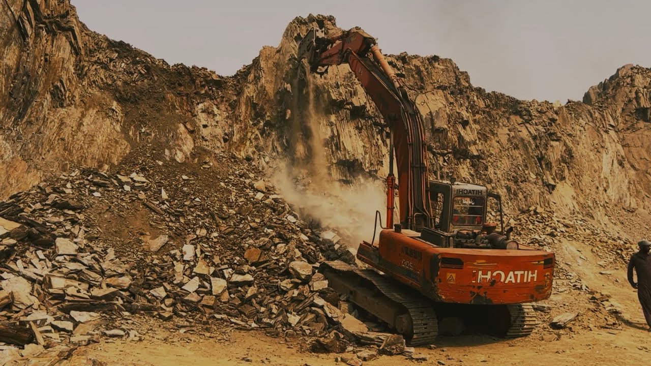 Amazing excavator performance | Breaking huge rocks with powerful machinery 💯