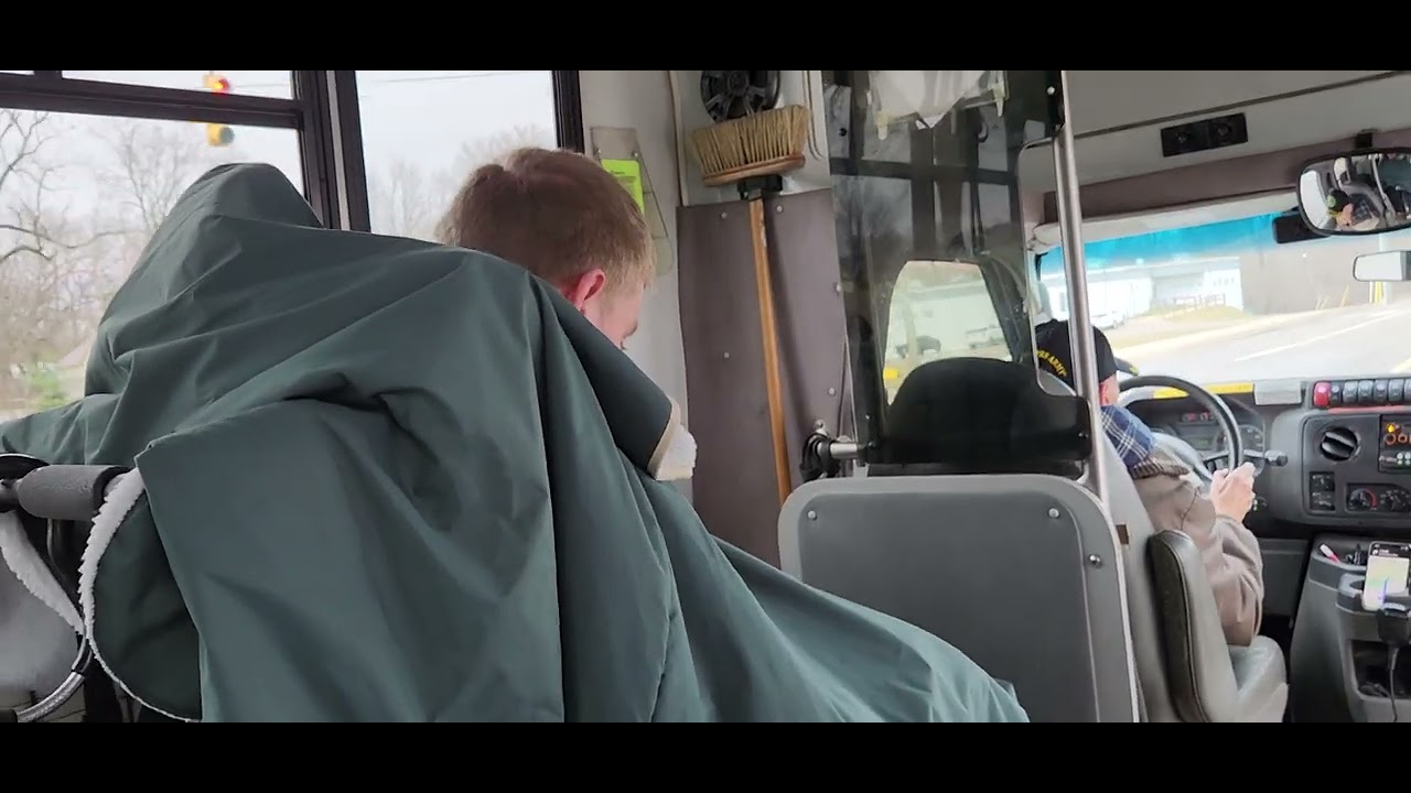 Sam riding bata bus home from school w/ Aunt Pam & bus driver Stoney after talent show 3.17.23