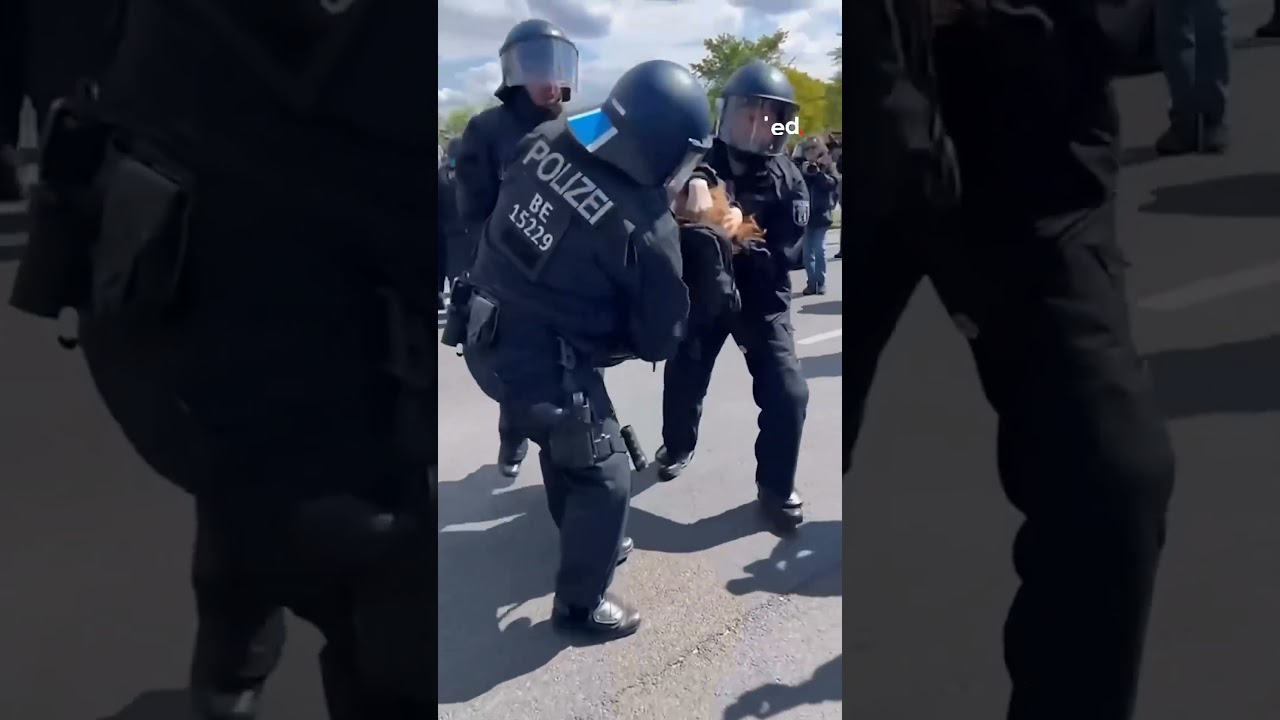 German police suppression of participants at a sit-in in front of Parliament