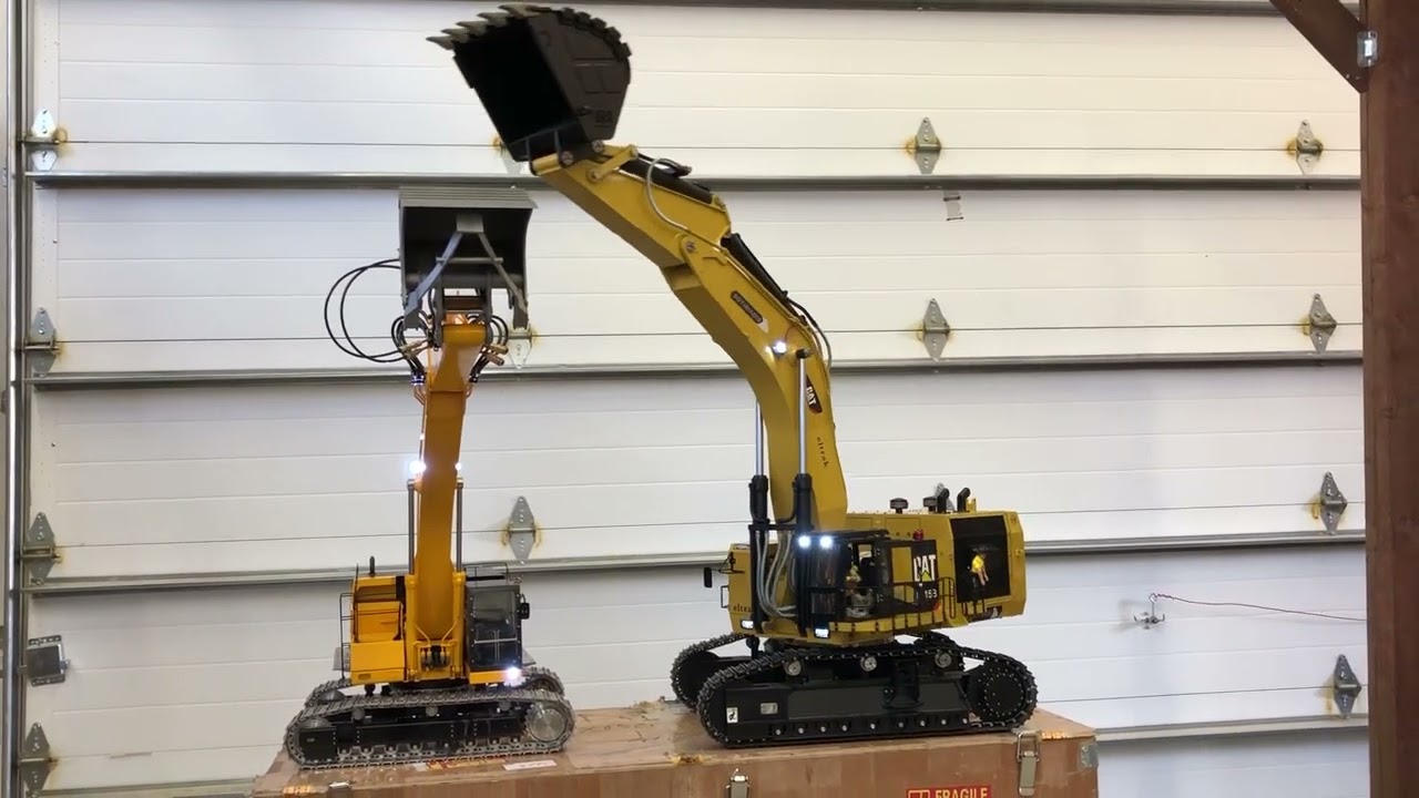CATERPILLAR  6015B and  LESU RC cat 374f excavators.