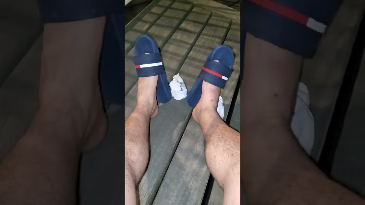 My feet in some Tommy slides. 