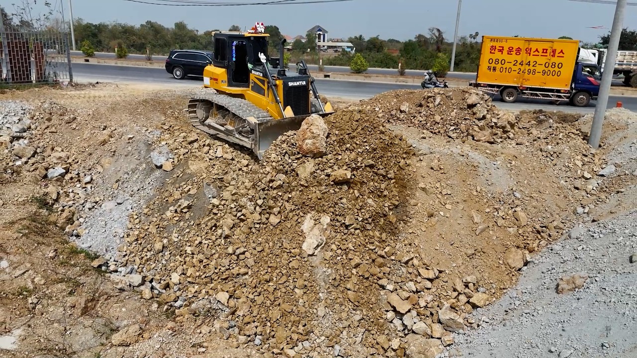 Landfill operation began cautiously, with bulldozer push soil to the side of the national highway