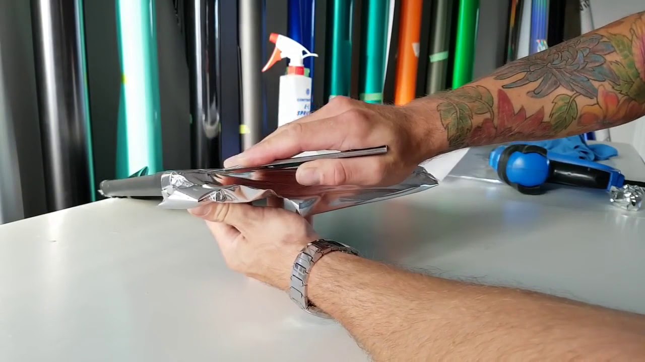 Silver Mirror Chrome Vinyl Wrap on a laptop